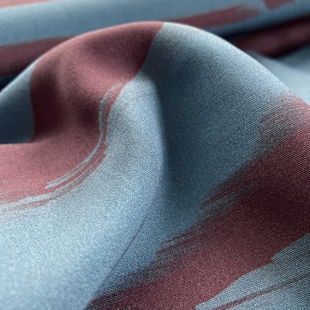 100% viscose print with red-blue landscape stripes