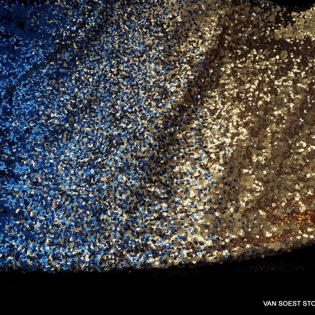 Opaque gold-blue Dégradé mini sequins on white stretch tulle. | View: Opaque gold-blue Dégradé mini sequins on white stretch tulle.