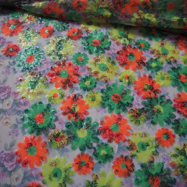 Colourful floral sequins in orange green yellow on printed rose tulle | View: Colourful floral sequins in orange green yellow on printed rose tulle