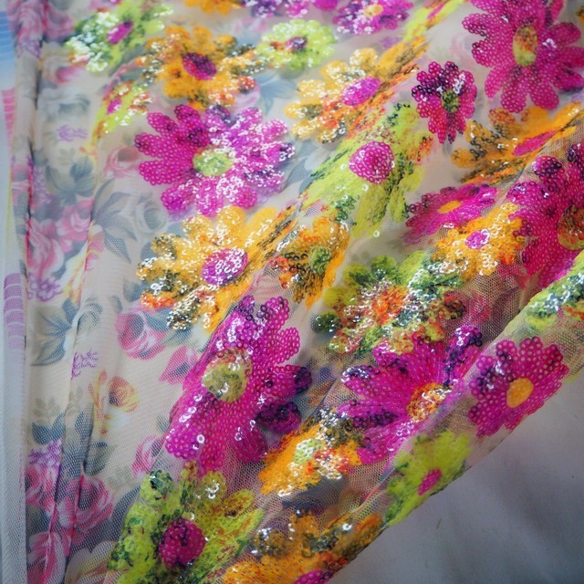 Colorful floral sequins in pink yellow green on printed rose tulle