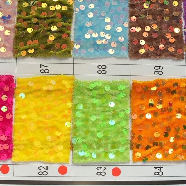 Coloured stretch velvet embroidered with coloured sequins