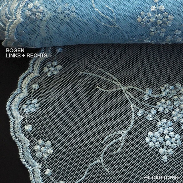 Fluttering fine mini flowers on tone in tone light blue tulle