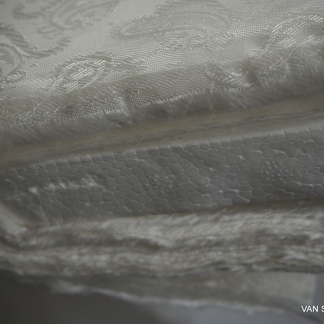 High quality jacquard lining fabric in panna.