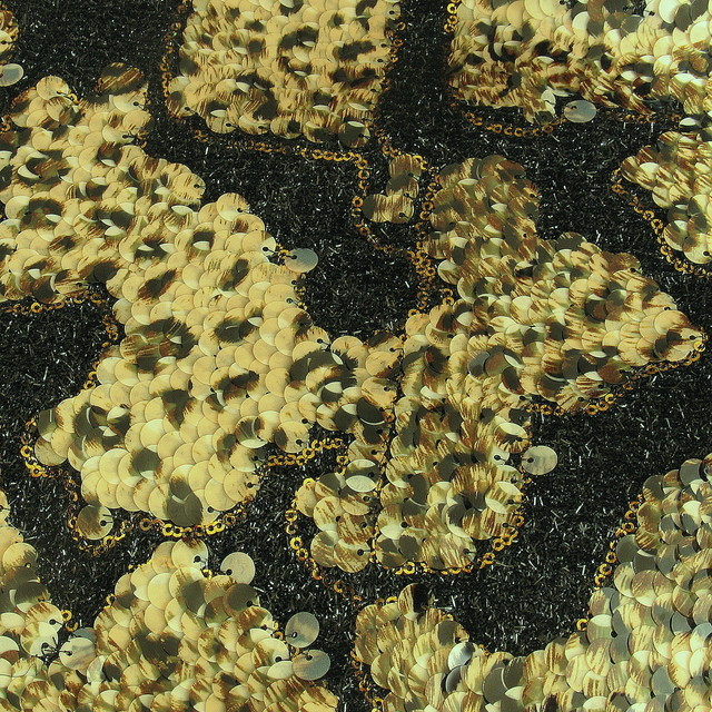 Reptile sequins on black raffia | View: reptile sequins on black raffia