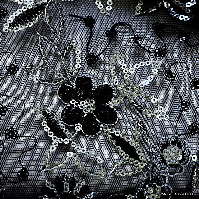 Silver sequins on black stiff mesh