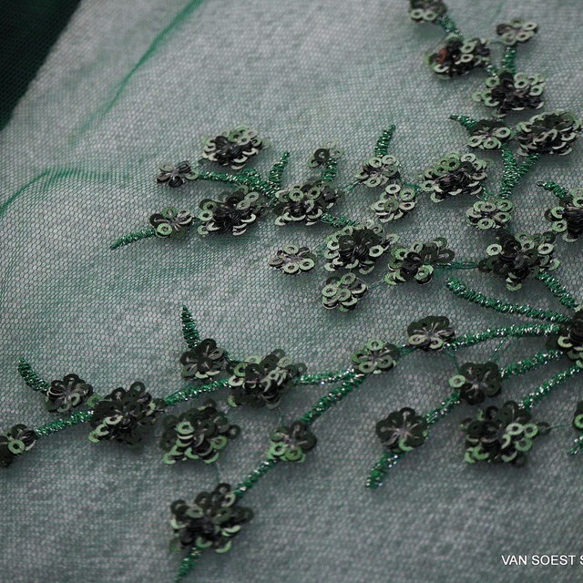 Fir green branches of mini sequins on green colored tulle. | View: Fir green branches of mini sequins on green colored tulle.