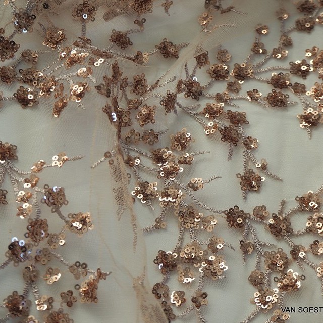 White-gold branches of mini sequins on skin colored tulle.