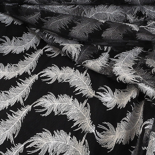 White feathers on black fantasy tulle | View: White feathers on black fantasy tulle