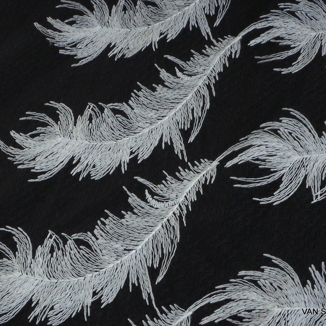 White feathers on black fantasy tulle | View: White feathers on black fantasy tulle