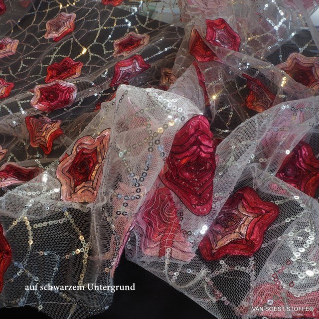 abstract red 3D flowers on a silver sequin net on white tulle | View: abstract red 3D flowers on a silver sequin net on white tulle