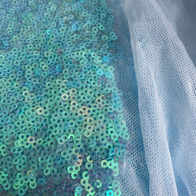 fluorescent mini sequins on tone on tone stretch tulle in light blue | View: fluorescent mini sequins on tone on tone stretch tulle in light blue