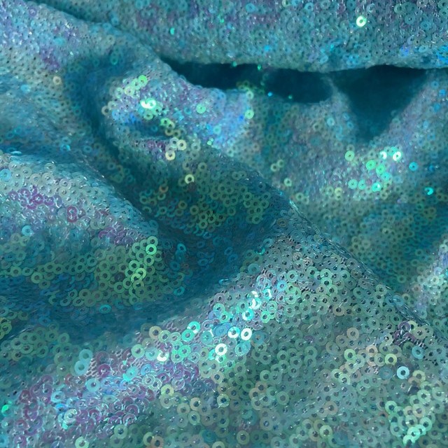 fluorescent mini sequins on tone on tone stretch tulle in light blue | View: fluorescent mini sequins on tone on tone stretch tulle in light blue