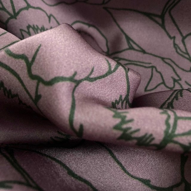 Delicate floral print in green lilac on lightweight rayon mix satin