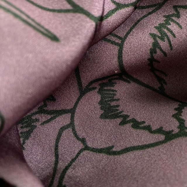 Delicate floral print in green lilac on lightweight rayon mix satin